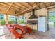 Community grilling area with picnic tables and a refrigerator at 8198 Terrace Garden N Dr # 403, St Petersburg, FL 33709