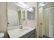 Bathroom with gray vanity, mirrored medicine cabinet and linen closet at 8198 Terrace Garden N Dr # 403, St Petersburg, FL 33709