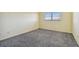Spacious bedroom with gray carpeting and a window at 8198 Terrace Garden N Dr # 403, St Petersburg, FL 33709