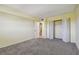 Bedroom with gray carpeting and double door closet at 8198 Terrace Garden N Dr # 403, St Petersburg, FL 33709
