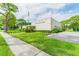 Olander Lake Center building, featuring landscaping and parking at 8198 Terrace Garden N Dr # 403, St Petersburg, FL 33709