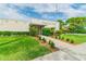 Olender Lake Community Center entrance with landscaped walkway at 8198 Terrace Garden N Dr # 403, St Petersburg, FL 33709