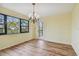 Bright dining room with hardwood floors and a chandelier at 8198 Terrace Garden N Dr # 403, St Petersburg, FL 33709