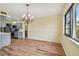 Bright dining room with hardwood floors and a chandelier at 8198 Terrace Garden N Dr # 403, St Petersburg, FL 33709