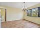 Bright dining room with hardwood floors and a chandelier at 8198 Terrace Garden N Dr # 403, St Petersburg, FL 33709