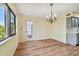 Bright dining room with hardwood floors and a chandelier at 8198 Terrace Garden N Dr # 403, St Petersburg, FL 33709