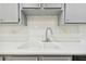 White double sink with a modern brushed nickel faucet at 8198 Terrace Garden N Dr # 403, St Petersburg, FL 33709