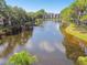 Reflecting lake with building and lush green surroundings at 8198 Terrace Garden N Dr # 403, St Petersburg, FL 33709