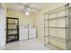 Laundry room with washer, dryer, shelving at 8198 Terrace Garden N Dr # 403, St Petersburg, FL 33709
