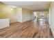 Spacious condo living room with wood-look floors at 8198 Terrace Garden N Dr # 403, St Petersburg, FL 33709