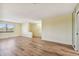 Bright living room with wood-look floors at 8198 Terrace Garden N Dr # 403, St Petersburg, FL 33709