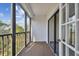 Screened balcony overlooking wooded area at 8198 Terrace Garden N Dr # 403, St Petersburg, FL 33709