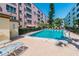 Community swimming pool with lounge chairs at 8198 Terrace Garden N Dr # 403, St Petersburg, FL 33709