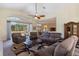 Relaxing living room with recliner chairs and a large window at 11004 Carnes St, Weeki Wachee, FL 34613
