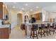 Open kitchen with island and breakfast bar at 11004 Carnes St, Weeki Wachee, FL 34613