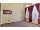 Bright bedroom with large windows and neutral colored walls at 11004 Carnes St, Weeki Wachee, FL 34613