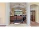 Spacious living room with large windows and comfortable seating at 11004 Carnes St, Weeki Wachee, FL 34613