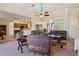 Open living room with kitchen view and comfortable seating at 11004 Carnes St, Weeki Wachee, FL 34613