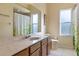 Clean bathroom with single vanity and shower/tub combo at 11004 Carnes St, Weeki Wachee, FL 34613