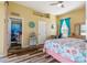 Coastal-themed bedroom with a queen bed and en-suite bath at 11004 Carnes St, Weeki Wachee, FL 34613