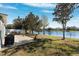 Backyard patio overlooking a serene lake, offering a peaceful view at 12214 Canyon Blvd, Spring Hill, FL 34610