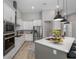 Modern kitchen with stainless steel appliances and island at 13409 Oldenburg Dr, Hudson, FL 34667
