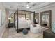 Spacious main bedroom with canopy bed and large mirrors at 13409 Oldenburg Dr, Hudson, FL 34667