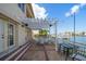Covered patio with seating and waterfront views at 18 Winston Dr, Belleair, FL 33756
