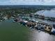 Aerial view of a luxurious waterfront community with various homes at 18 Winston Dr, Belleair, FL 33756
