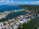 Aerial perspective of a waterfront residential neighborhood with boat docks at 18 Winston Dr, Belleair, FL 33756