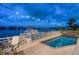 Tranquil pool and patio area with waterfront views at 18 Winston Dr, Belleair, FL 33756