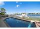 Relaxing rectangular pool with water views at 18 Winston Dr, Belleair, FL 33756