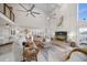 Open living space with water views, comfortable seating, and a large TV at 18 Winston Dr, Belleair, FL 33756