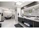 Spa-like bathroom featuring a freestanding soaking tub and modern vanity at 18 Winston Dr, Belleair, FL 33756