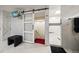 Bathroom with a barn door, walk-in shower, and modern finishes at 18 Winston Dr, Belleair, FL 33756