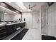 Elegant bathroom with marble finishes, double vanity, and large mirror at 18 Winston Dr, Belleair, FL 33756