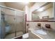 Clean bathroom with a shower/tub combo and granite countertop at 18 Winston Dr, Belleair, FL 33756