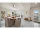 Bright dining area with water views and access to balcony at 18 Winston Dr, Belleair, FL 33756