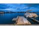 Private dock with boat lift and stunning sunset views at 18 Winston Dr, Belleair, FL 33756
