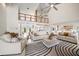 Spacious living room with high ceilings, neutral colors, and ample seating at 18 Winston Dr, Belleair, FL 33756