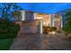 Stunning waterfront home with a large driveway and beautiful landscaping at 18 Winston Dr, Belleair, FL 33756