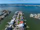 Aerial view of waterfront homes with private docks and boat access at 18 Winston Dr, Belleair, FL 33756