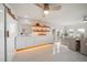 Modern white kitchen with stainless steel appliances and ample counter space at 18 Winston Dr, Belleair, FL 33756