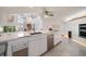 Spacious kitchen with large island, stainless steel appliances, and white cabinets at 18 Winston Dr, Belleair, FL 33756