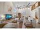 Spacious living room with high ceilings, lots of natural light, and water views at 18 Winston Dr, Belleair, FL 33756