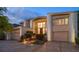 Two-story home with double garage and landscaping at 18 Winston Dr, Belleair, FL 33756