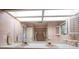 Bright bathroom with double sinks and skylight at 18 Winston Dr, Belleair, FL 33756