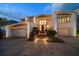 Two-story home with double garage and landscaping at 18 Winston Dr, Belleair, FL 33756