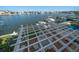 Covered patio overlooking the canal with seating and a pool at 18 Winston Dr, Belleair, FL 33756