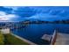 Serene waterfront view with private dock and boats at 18 Winston Dr, Belleair, FL 33756